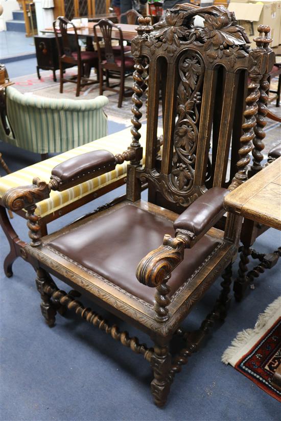 A set of seven Carolean style oak dining chairs (two having arms)